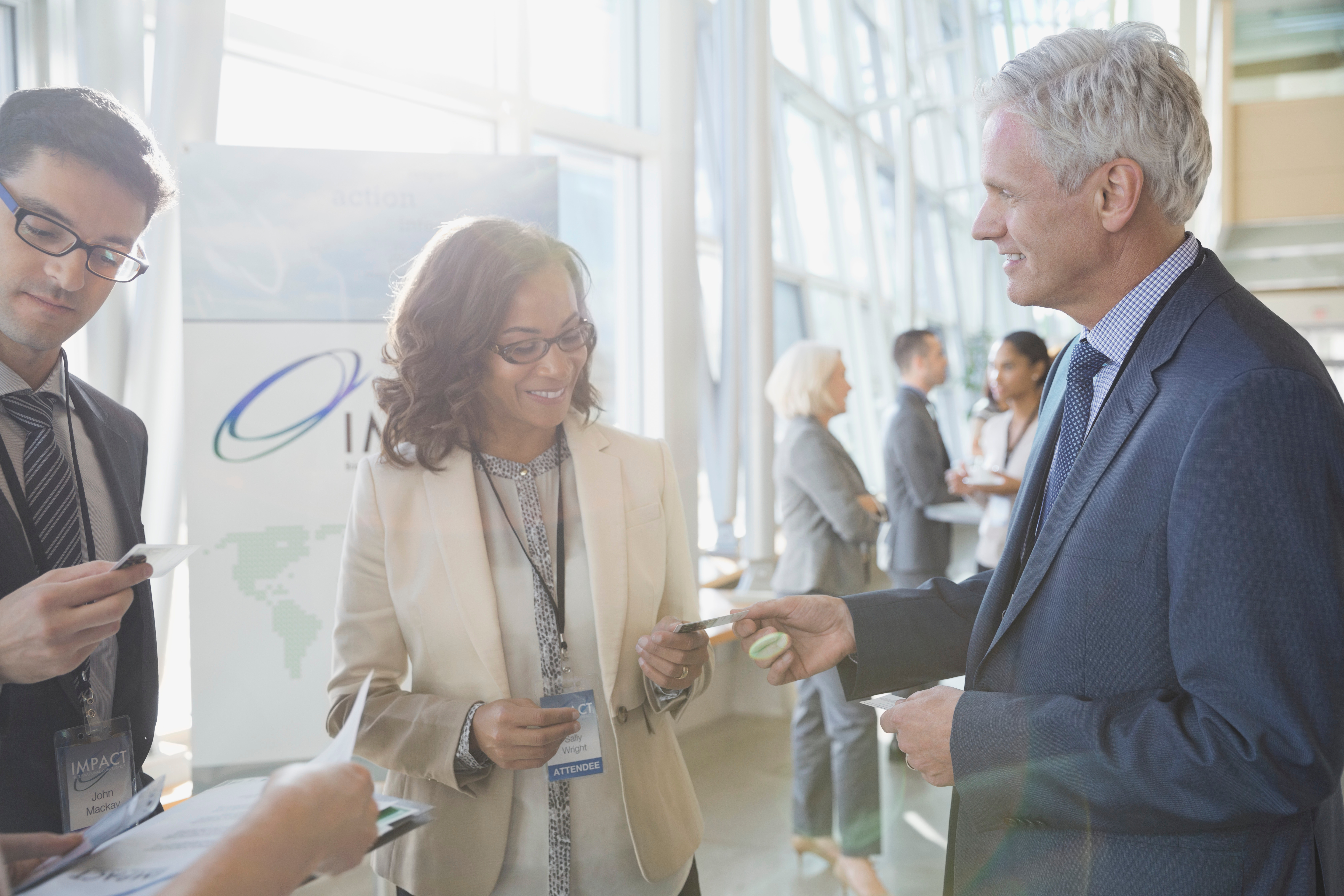 Business professionals exchanging business cards