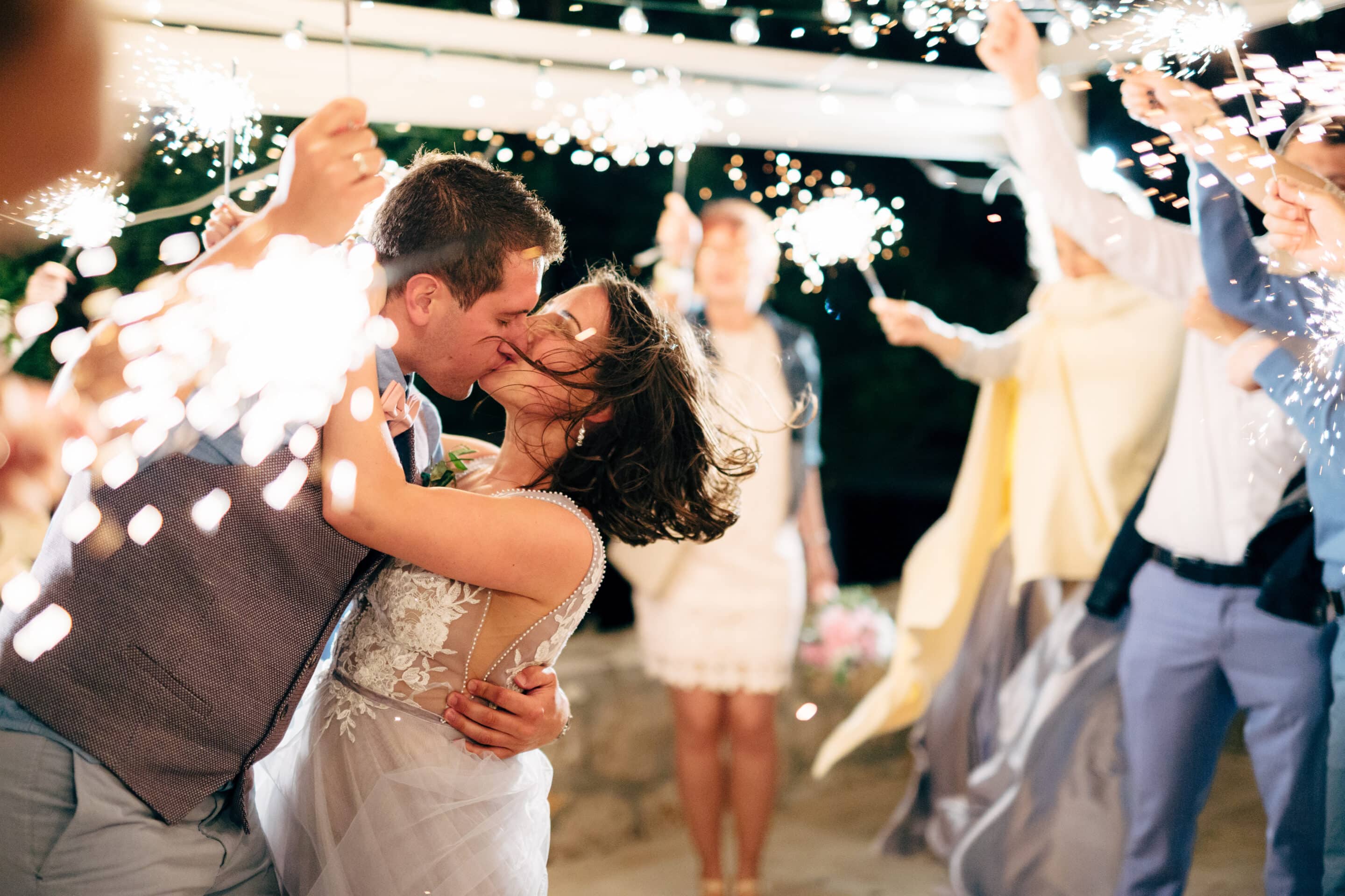 Newlywed couple kissing at their wedding reception at the Heritage Center of Brooklyn Center.